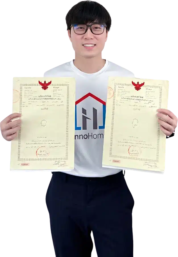 The InnoHome team holding a title deed